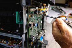 cropped-hand-repairing-cpu