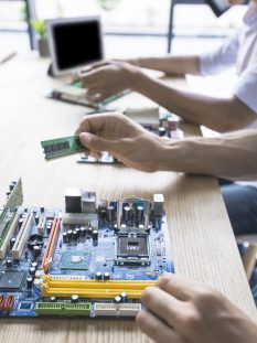 technician-repairing-computer-motherboard