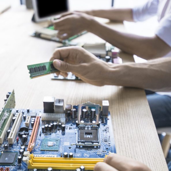 technician-repairing-computer-motherboard