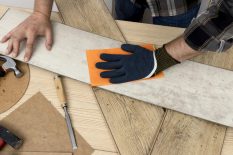 top-view-man-using-sand-paper-carpentry-workshop-concept